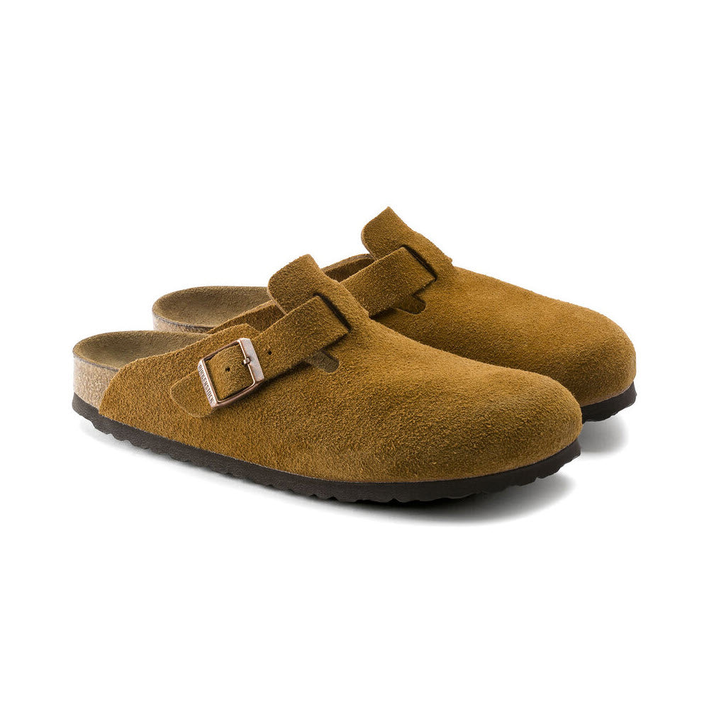 A pair of Birkenstock Boston Mink women&#39;s clogs with a soft footbed and adjustable straps, isolated on a white background.