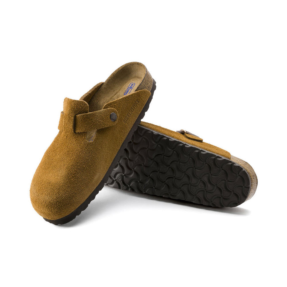A pair of Birkenstock Boston Mink - Womens clogs with a soft footbed, an adjustable strap, and black rubber soles, displayed against a white background.