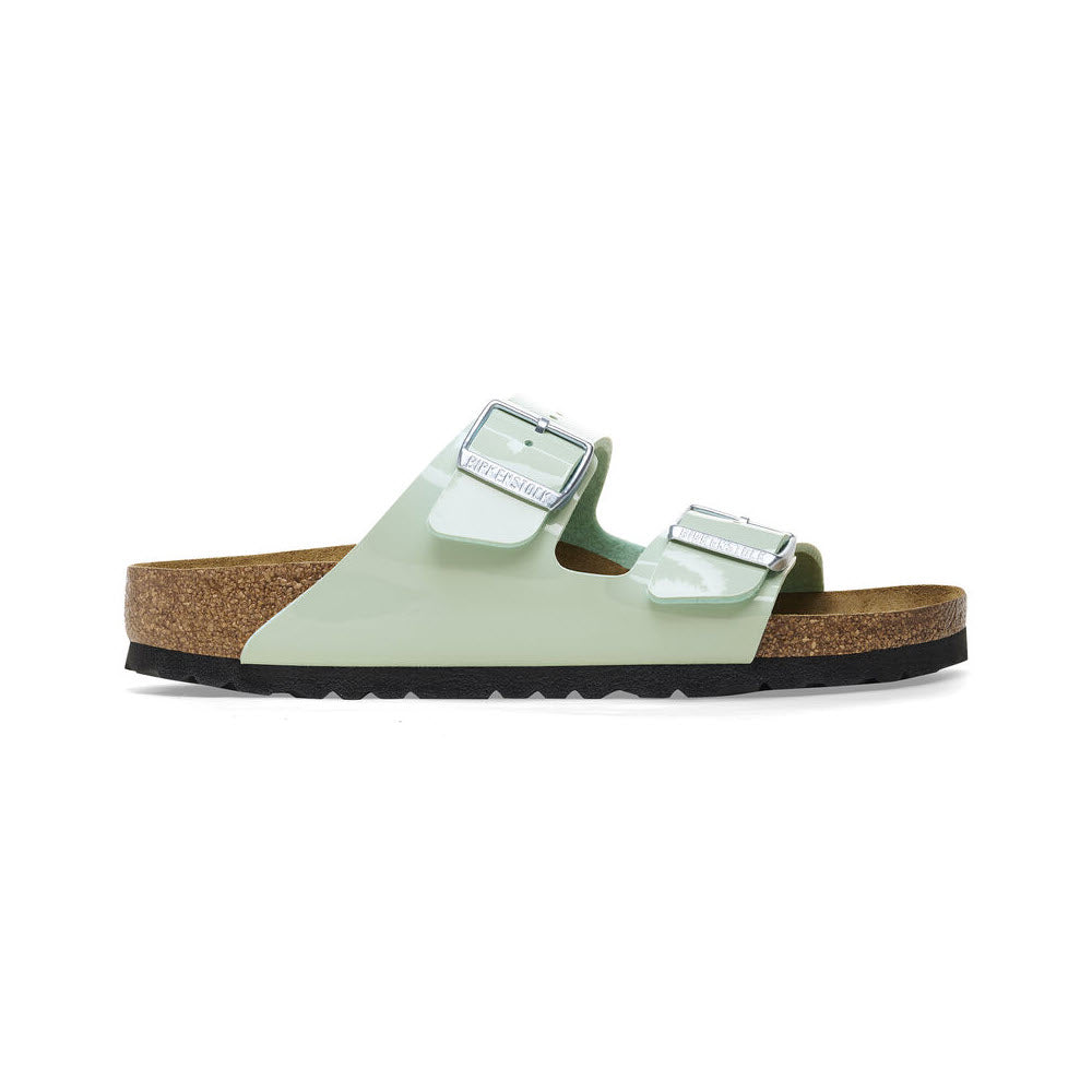 A pair of light green Birkenstock Arizona sandals with double straps and buckles on a white background.