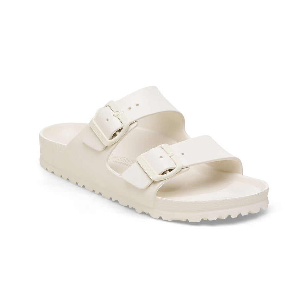 A single beige Birkenstock Arizona slide sandal with two adjustable buckle straps, featuring a molded footbed and a ridged sole.