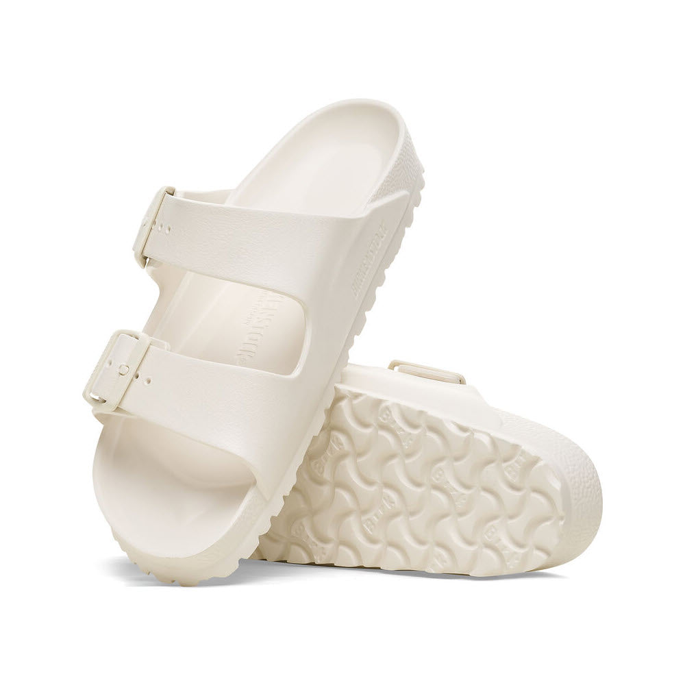A pair of Birkenstock Arizona EVA eggshell slide sandals with adjustable straps and textured soles, displayed against a plain white background.