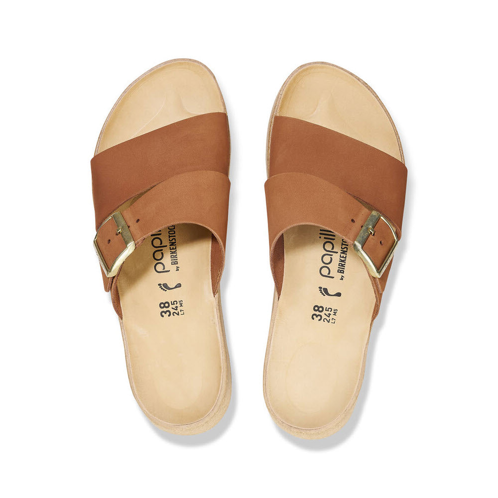 A pair of brown Birkenstock ALMINA PECAN leather sandals with buckles and a contoured footbed on a white background.
