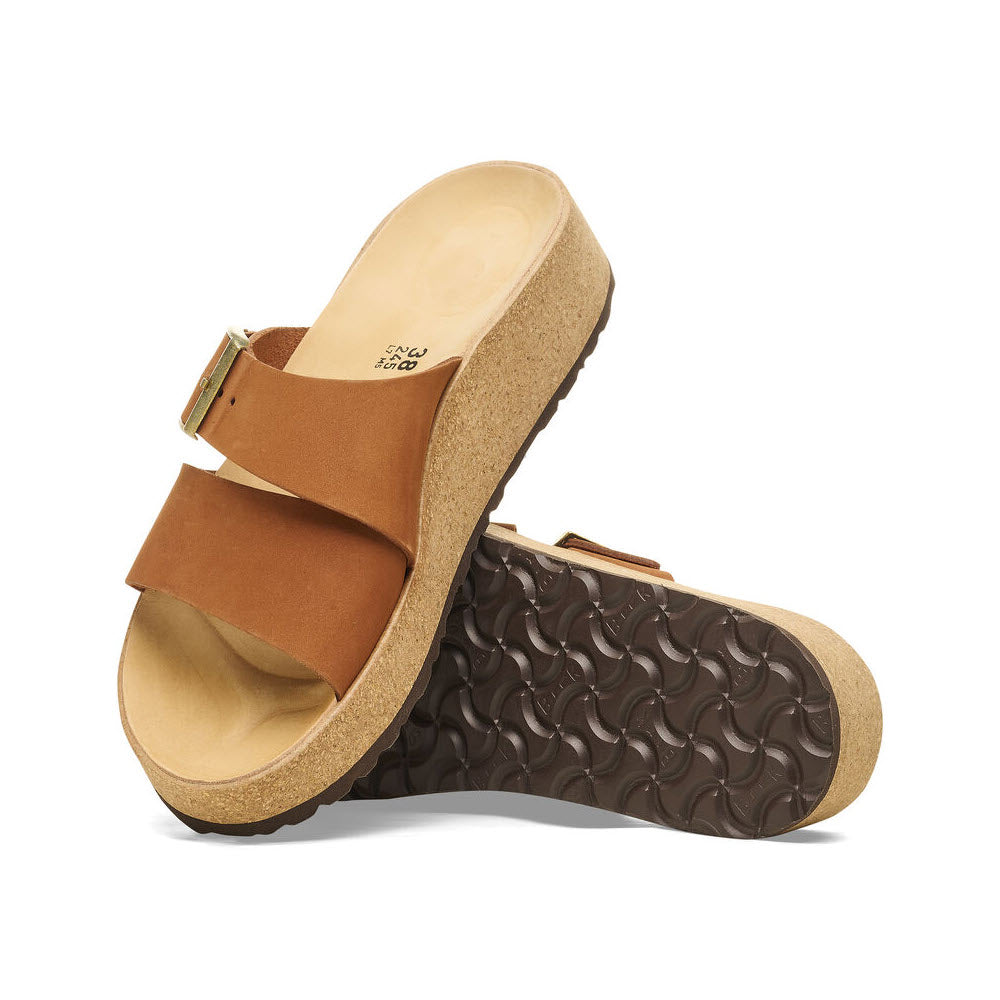 A single Birkenstock Almina Pecan sandal with an adjustable strap and a contoured footbed, shown at a side angle with a focus on the profile and tread design.