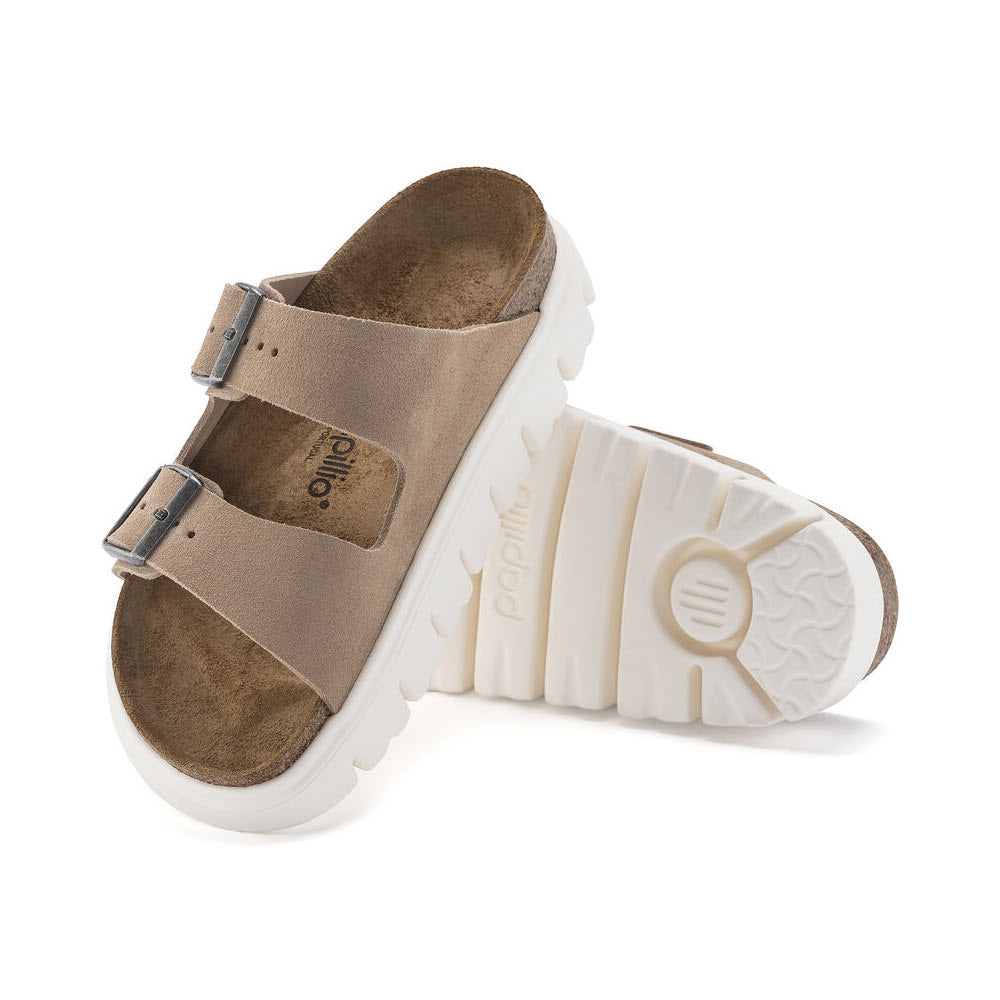 A single beige Birkenstock Arizona Chunky Warm Sandal with two adjustable straps and a white serrated platform sole, displayed on a white background.
