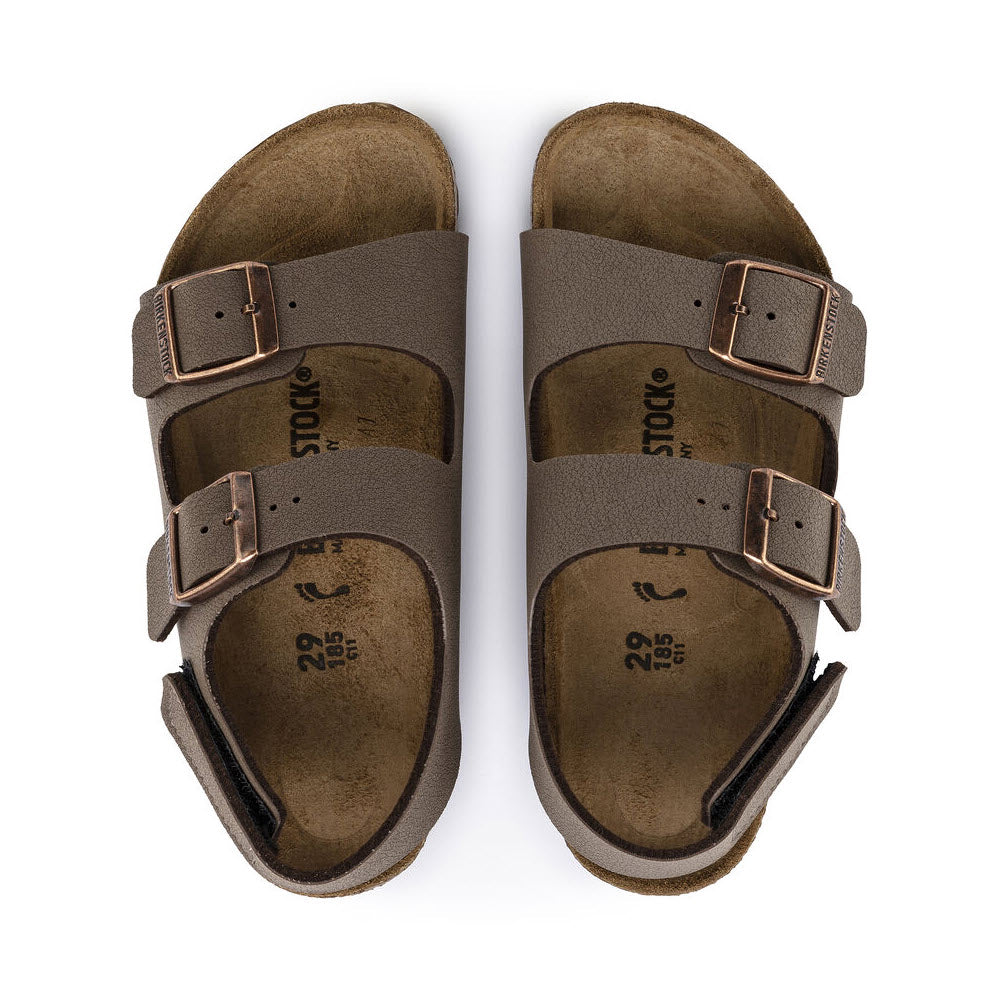 A pair of brown Birkenstock Milano Hook &amp; Loop Mocha Birkibuc sandals with adjustable backstrap, viewed from above on a white background.