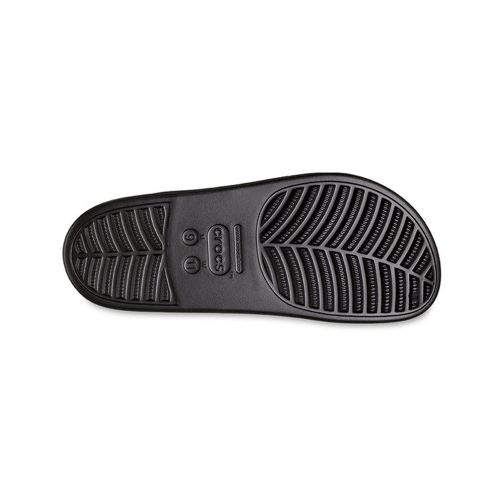 A Crocs shoe sole with a pattern of curved lines and ridges, featuring a logo in the central area, made with Crosslite construction.