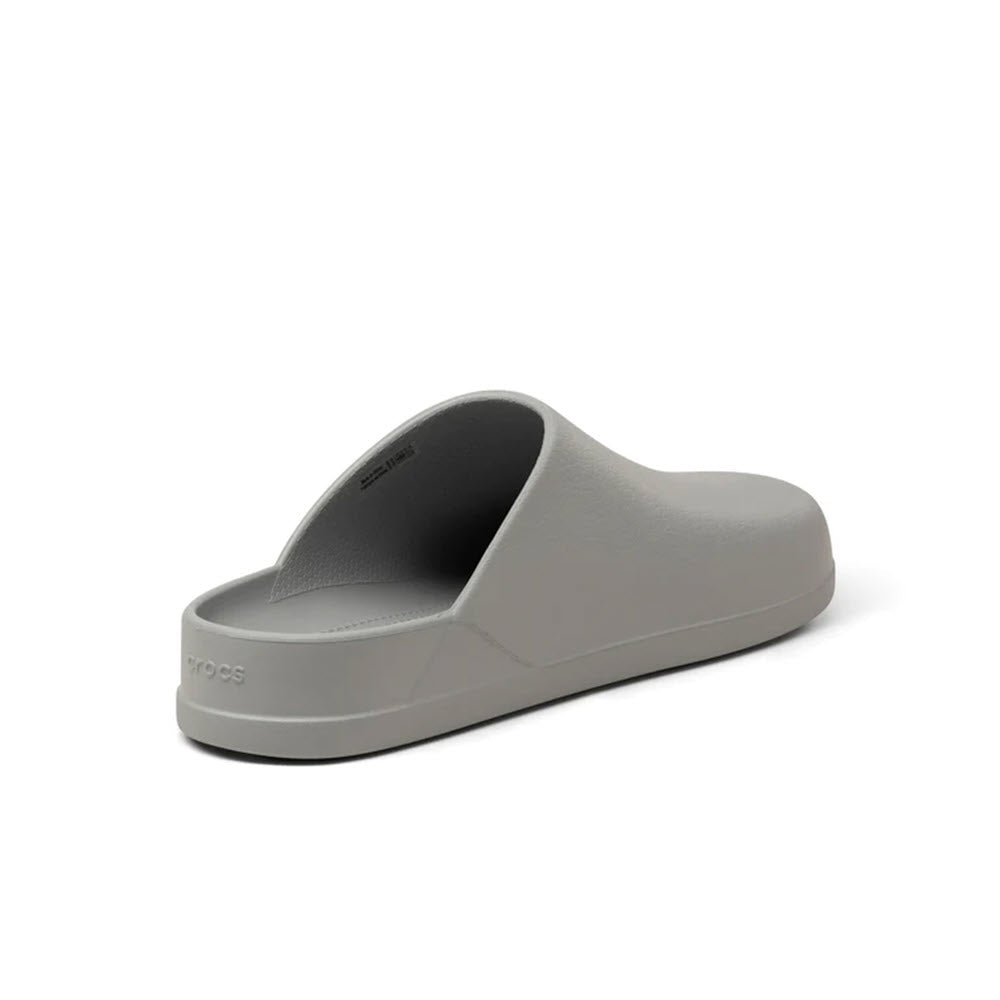 A single gray Crocs Dylan Clog on a white background. would be replaced with: A single CROCS DYLAN CLOG LIGHT GREY - WOMENS on a white background.