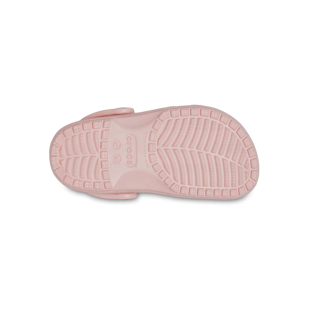 A single pale pink Crocs Classic Clog Quartz Toddler shoe, crafted from Croslite material, viewed from the sole.