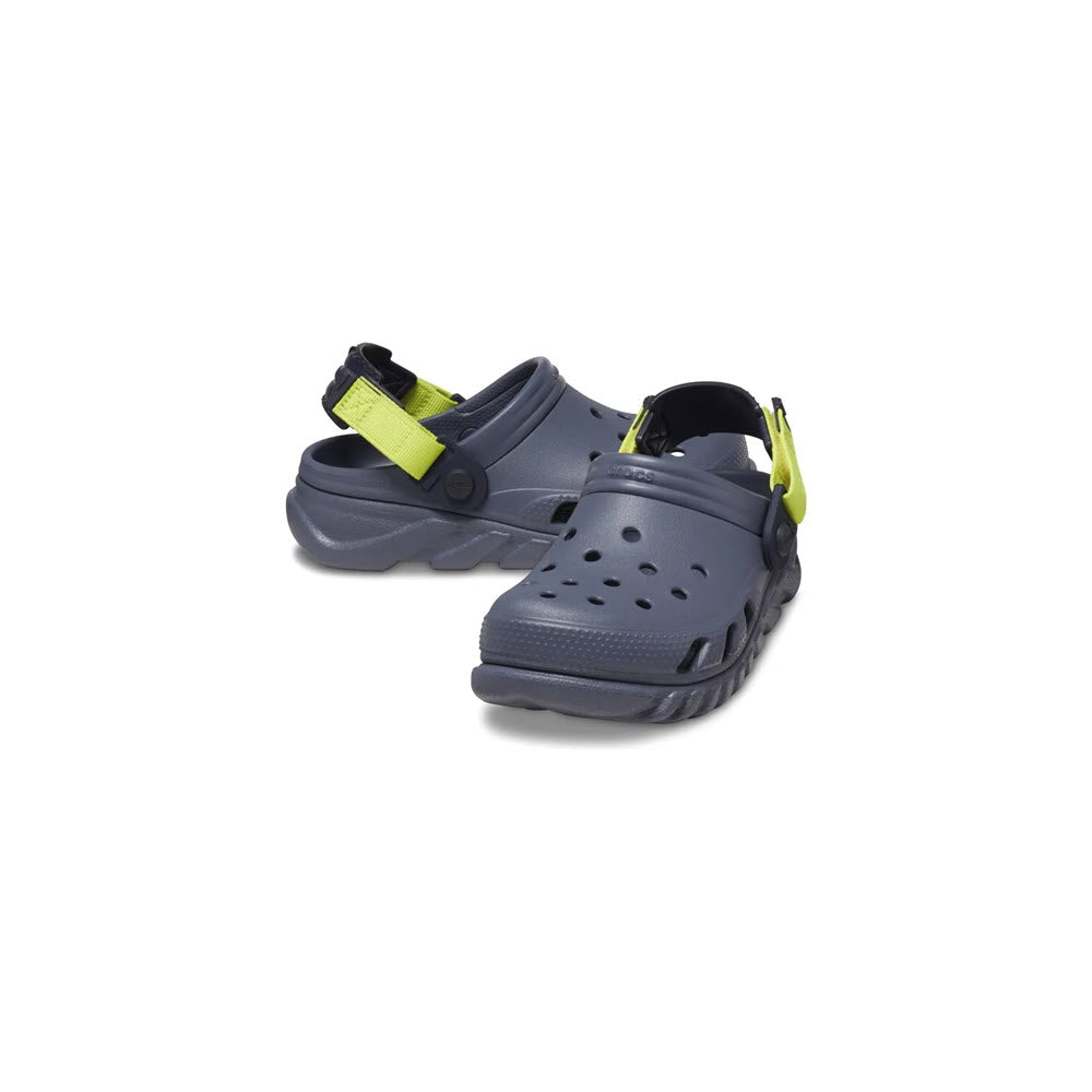 A pair of gray Crocs Duet Max clog Storm sandals with yellow adjustable straps on a white background.