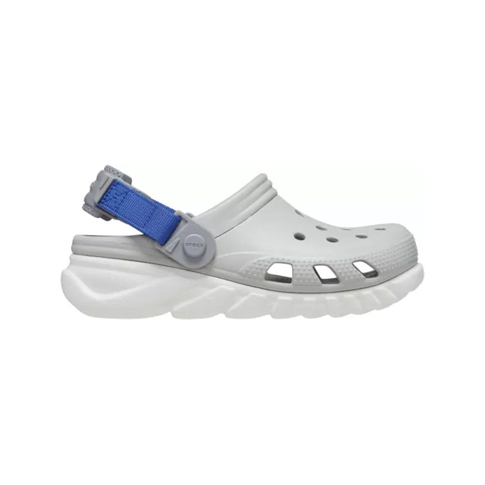 A white CROCS DUET MAX CLOG ATMOSPHERE - KIDS with a sport-inspired chunky sole and blue adjustable strap.