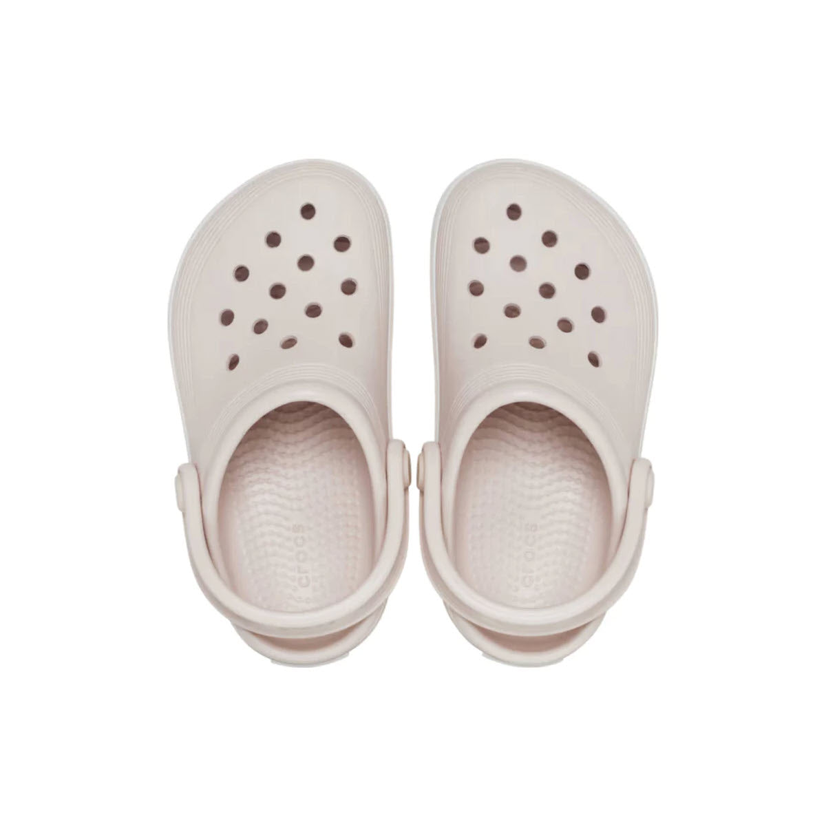 A pair of Crocs Off Court clogs in quartz color, ideal for school wear, isolated on a white background.