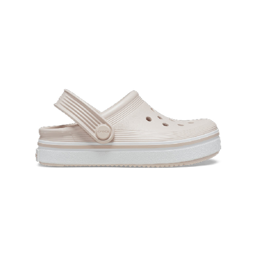 Beige Crocs classic clogs sandal with a platform sole, suitable for school wear.