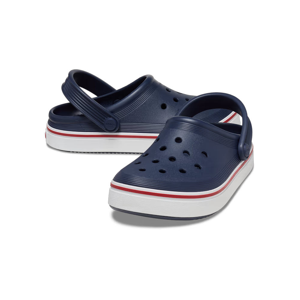 A pair of Crocs Off Court Clog navy/pepper sandals with white and red striped soles, showcasing sneaker-like sophistication, on a white background.