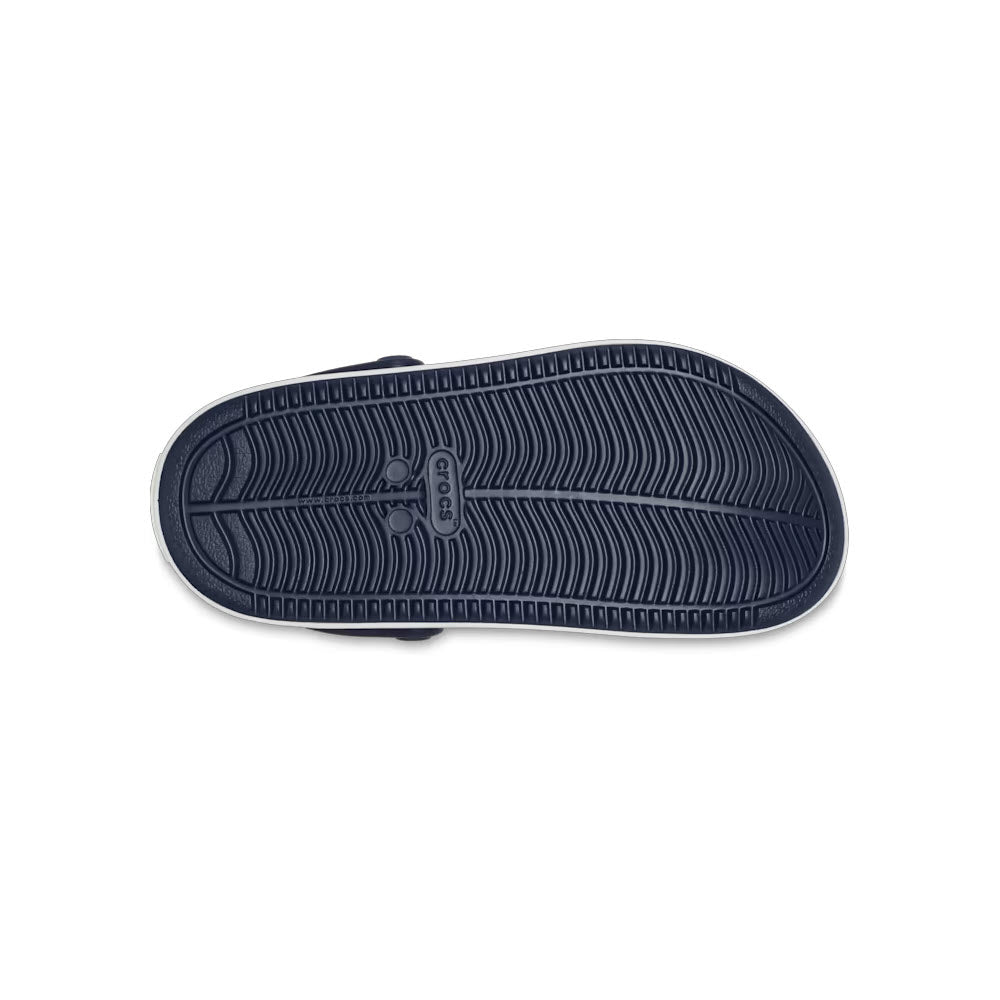 Sole of a Crocs shoe with tread pattern and sneaker-like sophistication on a white background.