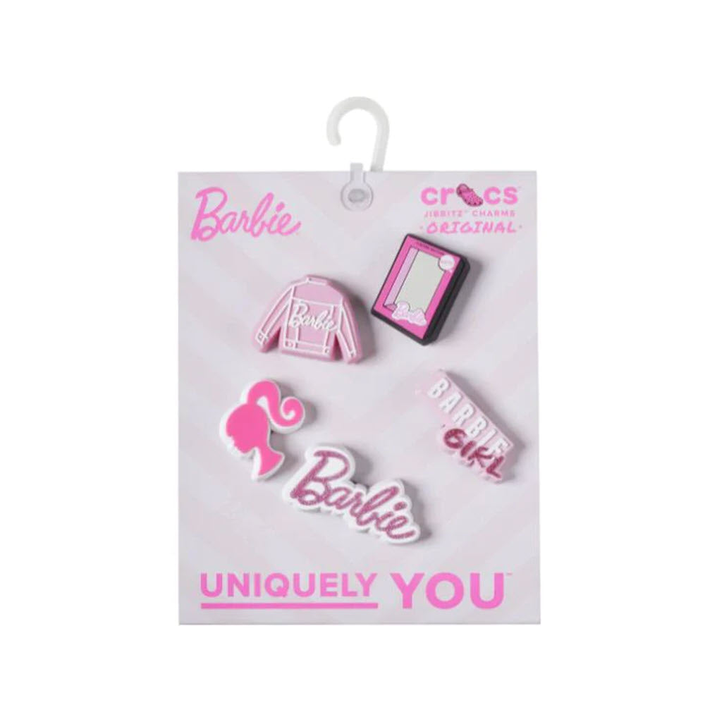 A JIBBITZ BARBIE 5 PACK featuring a pink hat, flamingo, and mobile phone designs, labeled &quot;fashionably fun,&quot; by Crocs.