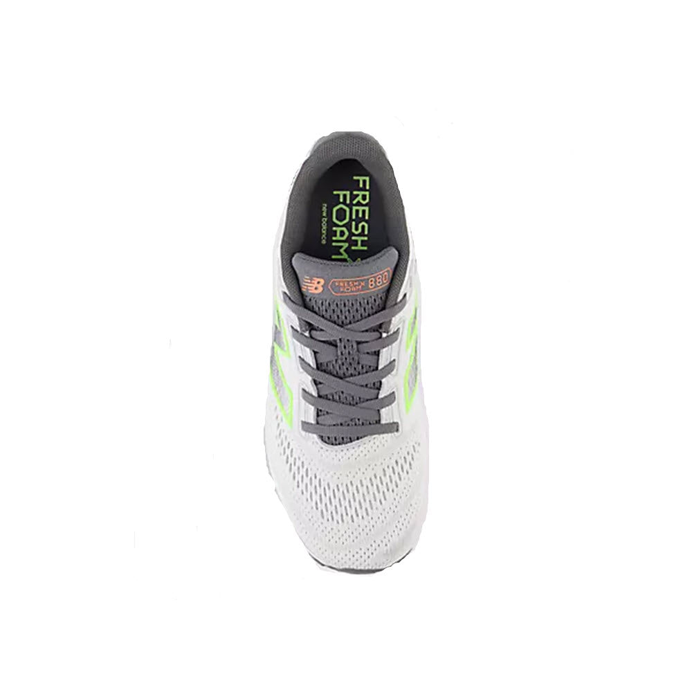 A top view of a single gray and white New Balance W880v14 running shoe with neon green accents.