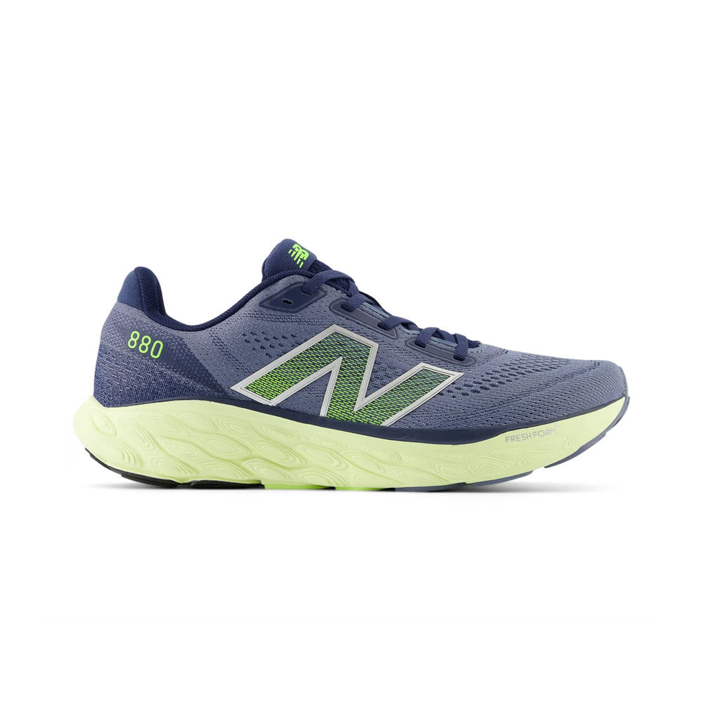 A blue New Balance Fresh Foam X 880v14 running shoe with a green logo and accents on a white background.