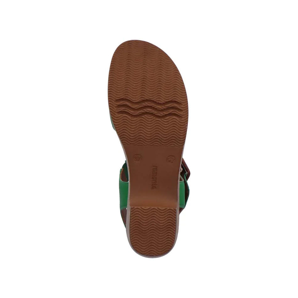 Sole of a sandal with textured tread pattern, viewed from below, featuring an emerald green Remonte strap.