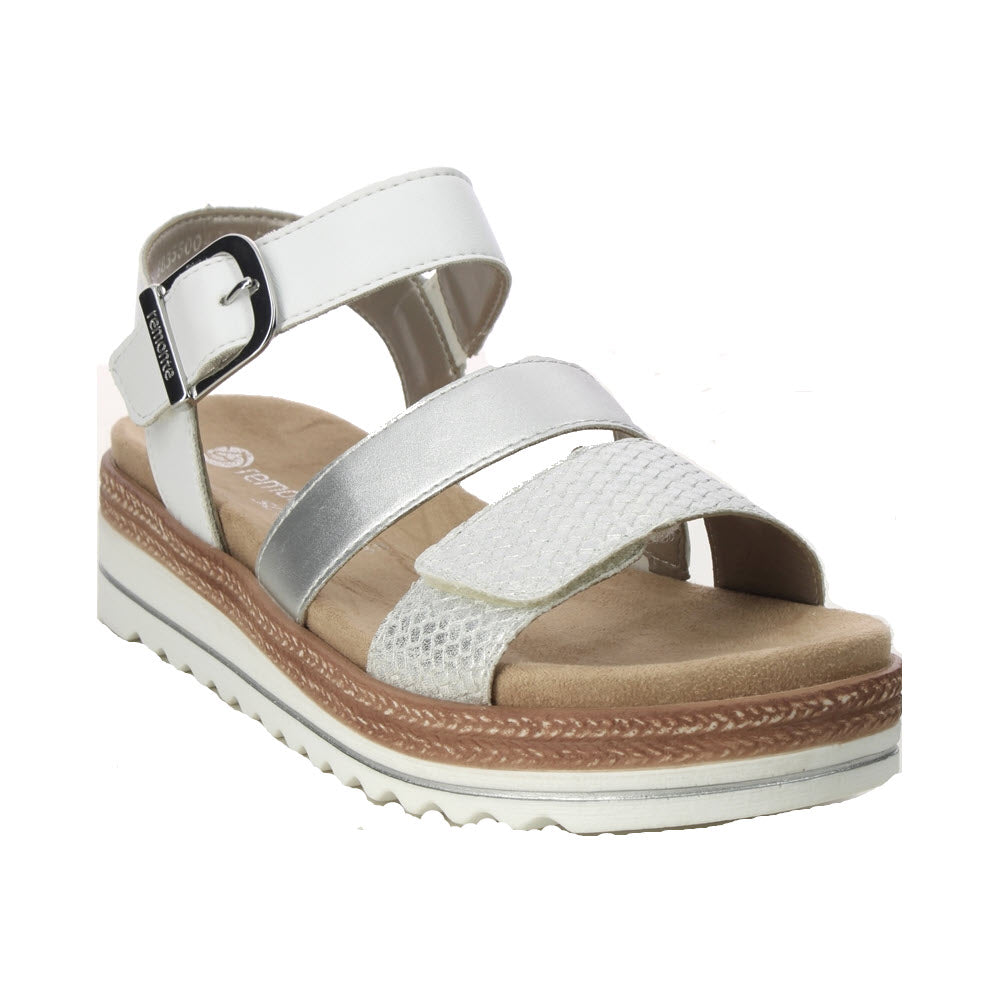 Remonte white strappy sandal with a Velcro closure, featuring a silver strap and a ridged sole on a white background.