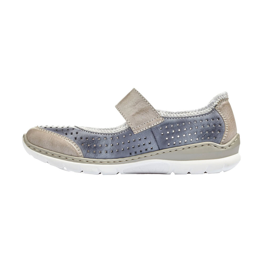 Side view of a Rieker blue and beige casual women&#39;s sneaker with hook and loop closure and decorative perforations.