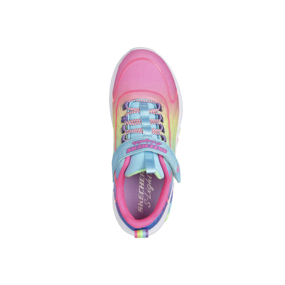 Top view of a SKECHERS RAINBOW CRUISERS TURQUOISE MULTI - KIDS with pink, yellow, and blue accents featuring an ombre woven upper, isolated on a white background.