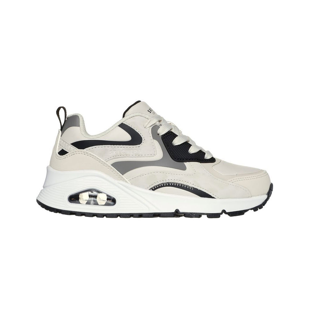 A side view of a modern white and gray Skechers Street™ Uno Gen1 sneaker with black accents and a Skech-Air® airbag midsole.