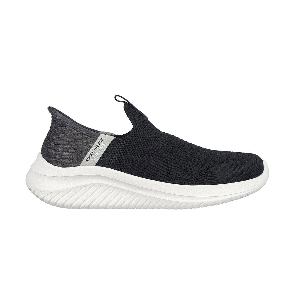 Black and white Skechers Slip Ins Ultra Flex 3.0 sneaker with a textured upper and thick, ridged sole, featuring Air-Cooled Memory Foam, isolated on a white background.