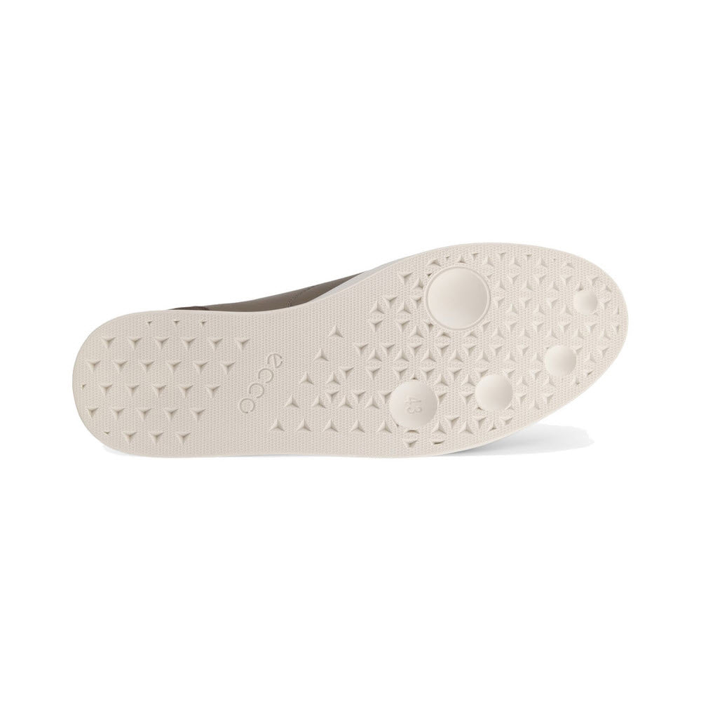Sole of an Ecco Street Lite M Court sneaker featuring raised star patterns and circular designs, displayed against a white background.