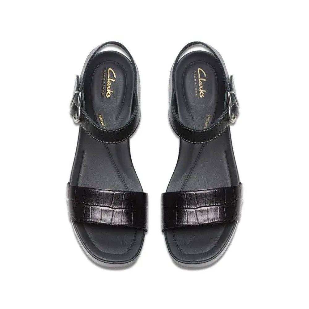 A pair of Clarks brand CLARKS SIVANNE BAY BLACK - WOMENS sandals featuring butter-soft black leather straps with a crocodile skin pattern, displayed on a white background.