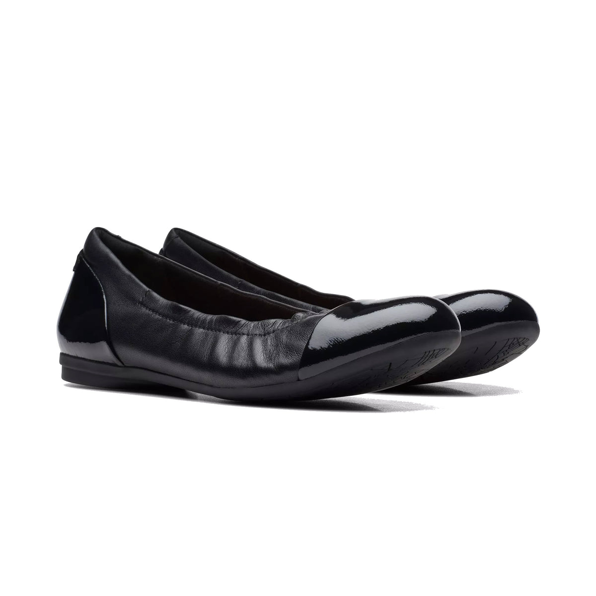 A pair of Clarks Rena Jazz black women&#39;s ballet flats with shiny patent leather toe caps and a Contour Cushion footbed, displayed against a white background.