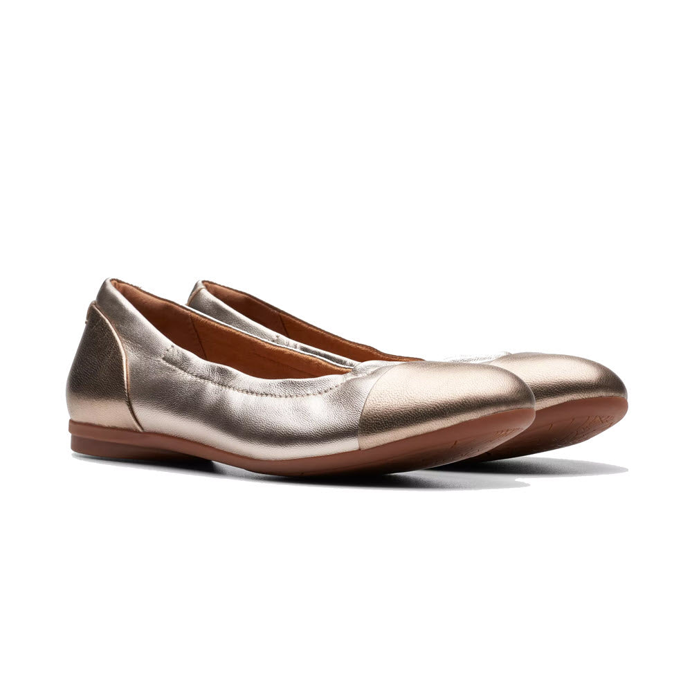 A pair of metallic bronze Clarks Rena Jazz ballet flats on a white background. 

would be replaced with:

A pair of CLARKS RENA JAZZ METALLIC MULTI - WOMENS ballet flats on a white background.