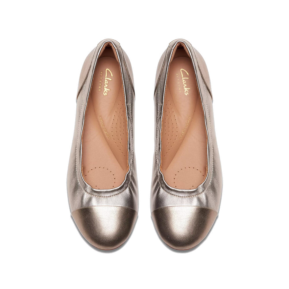A pair of metallic bronze Clarks Rena Jazz ballet flats, viewed from above on a white background.