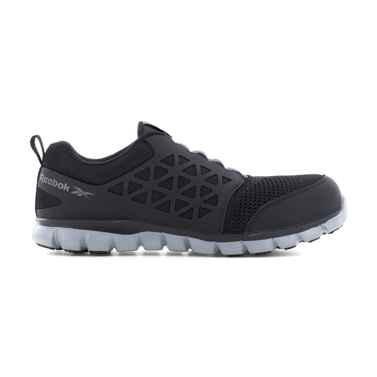 Black Reebok Work Sublite Composite Toe Slip On Work Shoe with a breathable mesh upper and MemoryTech Massage footbed, displayed against a white background.