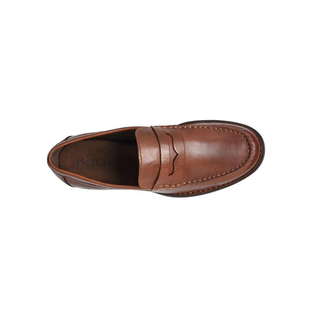 A brown Born Matthew slip on penny loafer with a black sole.