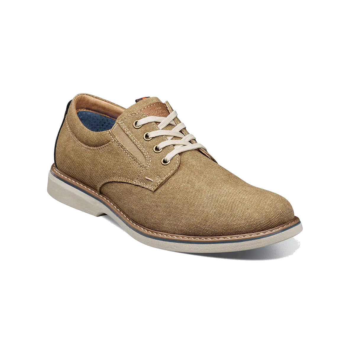 A single beige Nunn Bush Otto canvas plain toe Oxford khaki shoe with white laces and a contrasting white sole, displayed on a white background.