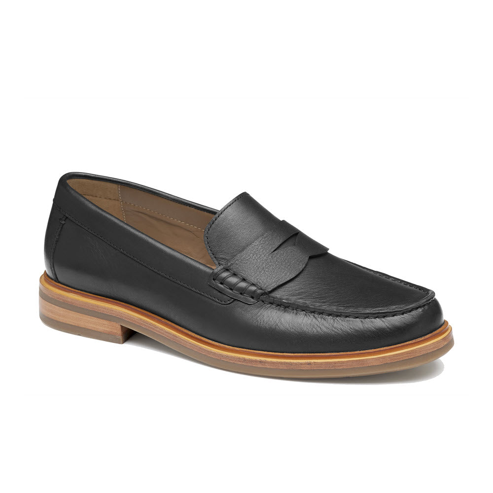 A Johnston & Murphy Lyles slip on penny black full grain loafer with a wooden sole, isolated on a white background.
