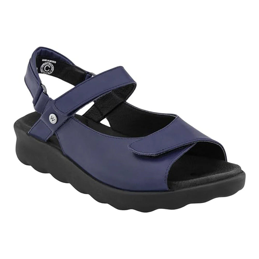 A single WOLKY PICHU PURPLE - WOMENS sandal with adjustable straps and a thick black sole with shock absorption, displayed on a white background.