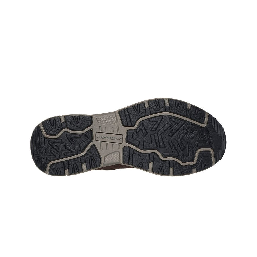 Bottom view of a Skechers Oak Canyon Brown - Mens outdoor trail shoe sole displaying a complex tread pattern with the Skechers brand name visible in the center.