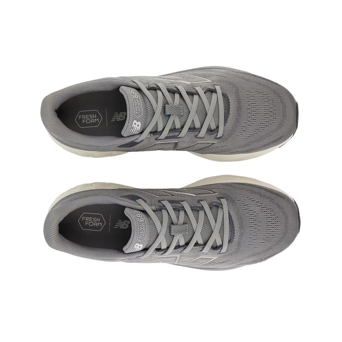 A pair of New Balance 680v8 Blue Harbor Grey/Magnet/Dark Silver running shoes, viewed from above, showcasing the laced-up fronts and the &quot;fresh foam&quot; insoles.