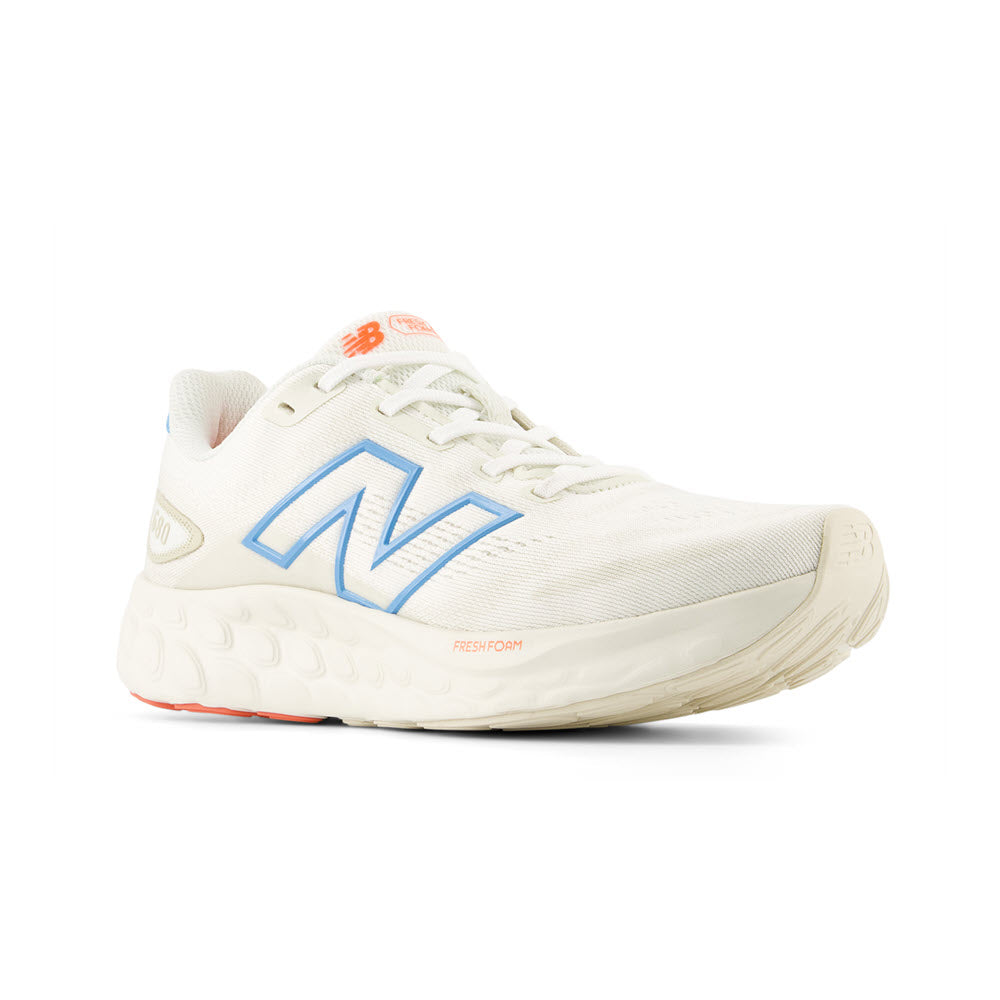 A single white New Balance Sea Salt/Lime Leaf/Coastal Blue sneaker with a large blue &#39;n&#39; logo on the side, featuring a thick, cushioned midsole.