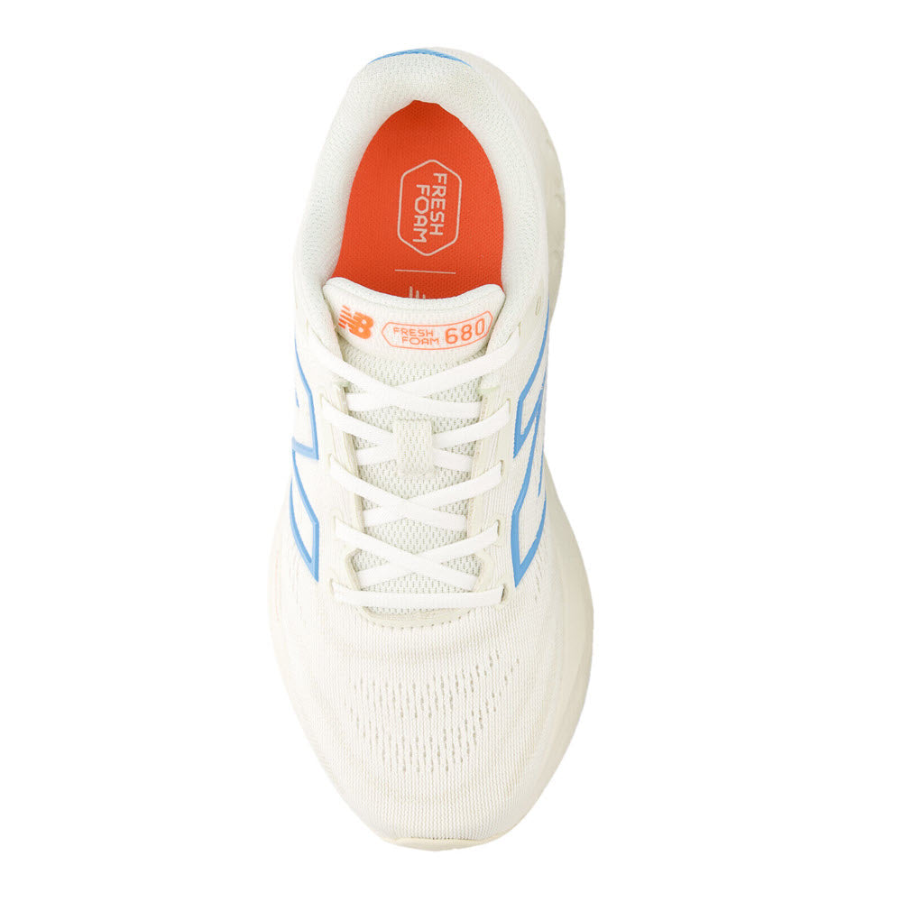 Top view of a white New Balance Sea Salt/Lime Leaf/Coastal Blue - Womens running shoe with light blue accents and &quot;Sea Salt/Lime Leaf/Coastal Blue&quot; branding on the insole.