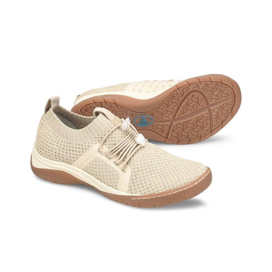 A pair of Align Torri Beige - Womens casual slip-on shoes with laces, featuring a knit upper and a slip-resistant outsole, displayed on a white background.