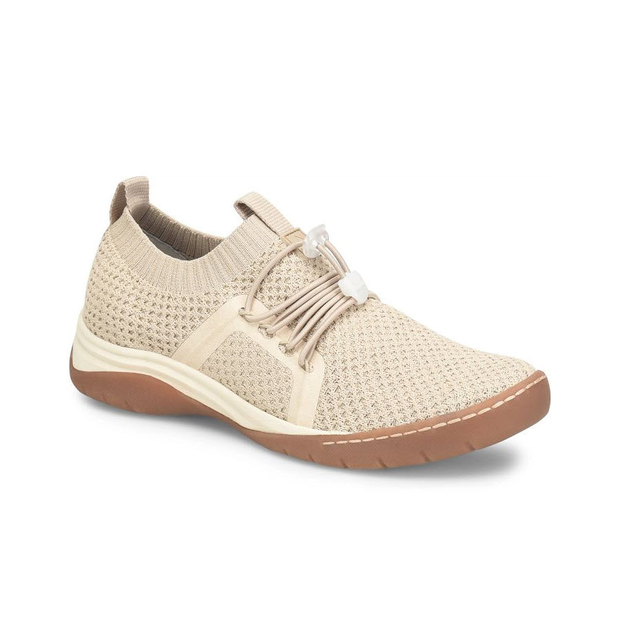A beige, sporty slip-on sneaker featuring a breathable knit upper and a bungee-laced front with a slip-resistant outsole is the ALIGN TORRI BEIGE - WOMENS by Align.