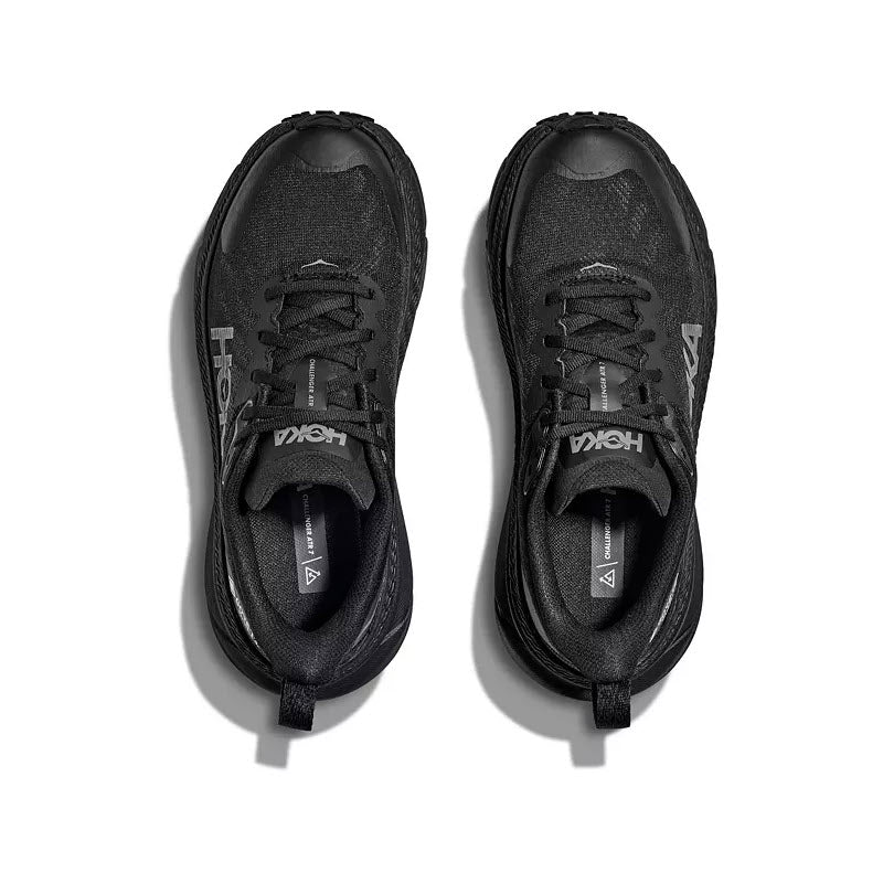 A pair of black HOKA CHALLENGER ATR 7 GTX running shoes with white logos, viewed from above on a white surface.