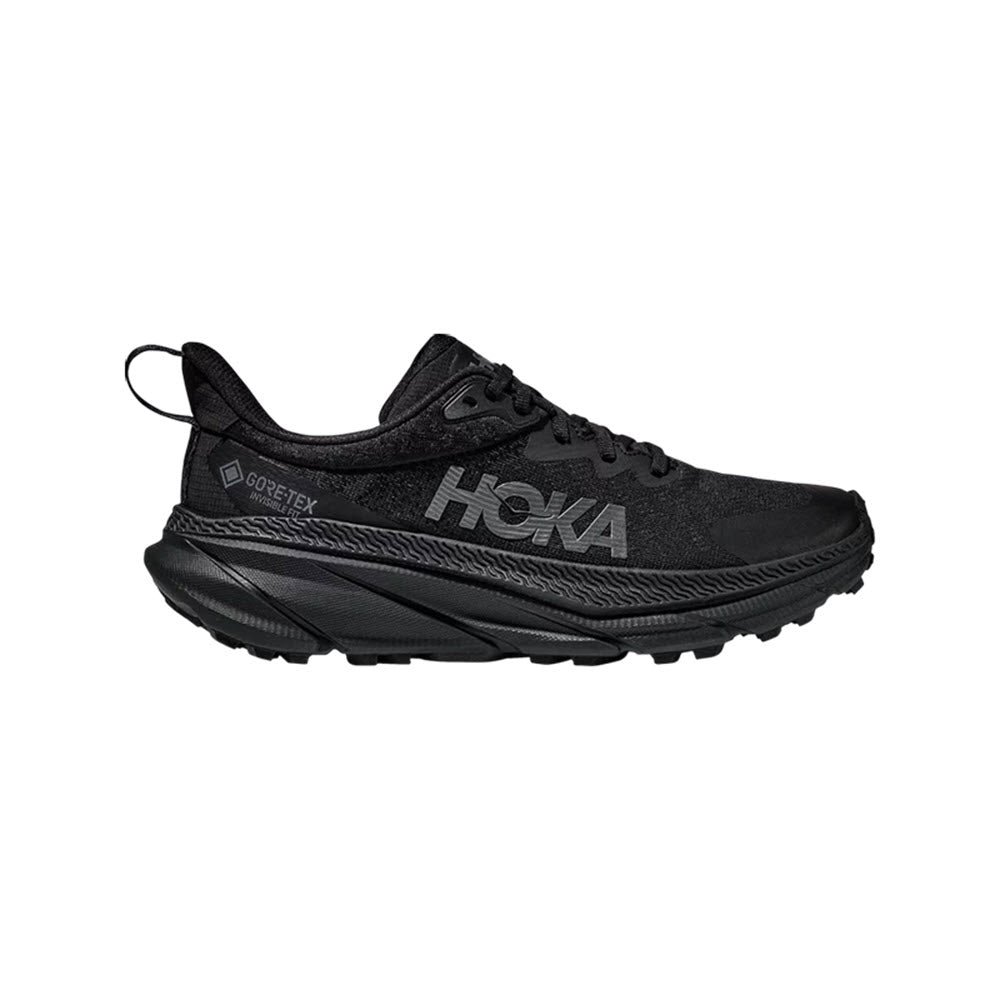 The HOKA CHALLENGER ATR 7 GTX BLACK/BLACK mens trail running shoe by Hoka features GORE-TEX INVISIBLE FIT, a thick cushioned sole, and a prominent Hoka logo on the side, shown from the left.