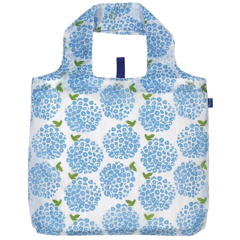 A reusable shopping bag with a blue floral pattern on a white background, featuring integrated handles and designed as an eco-friendly BLU BAG HYDRANGEA BLOSSOMS by Rockflowerpaper.