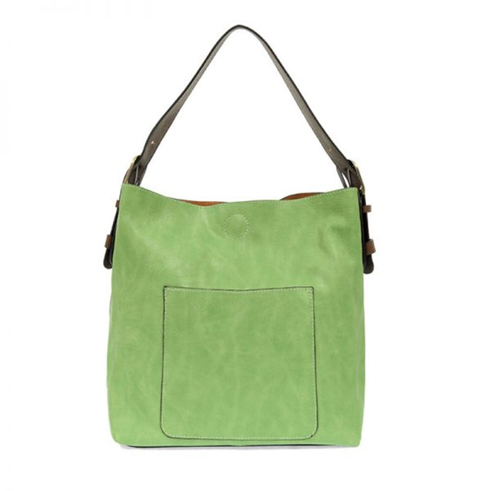 A JOY SUSAN HOBO BAG SPRING GREEN with a large front pocket and brown leather accents against a white background.