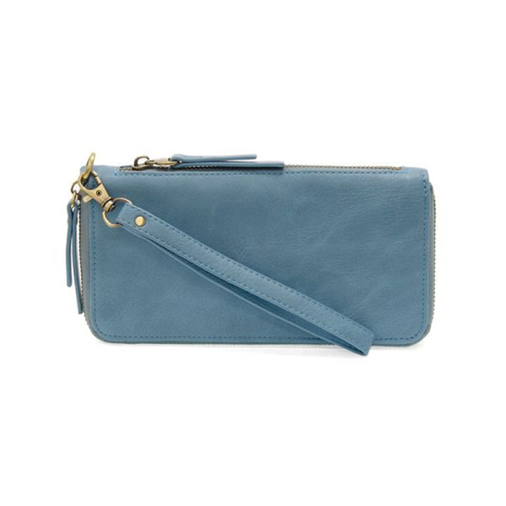 A JOY SUSAN Tranquil Blue vegan leather wristlet clutch with a zipper closure and a detachable strap, isolated on a white background.