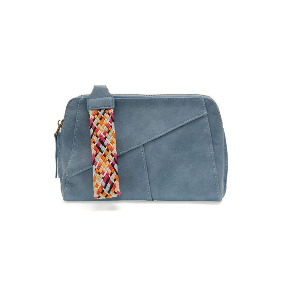 Small blue Joy Susan Gigi Crossbody Bag Bluebird with a removable wrist strap, featured on a white background.