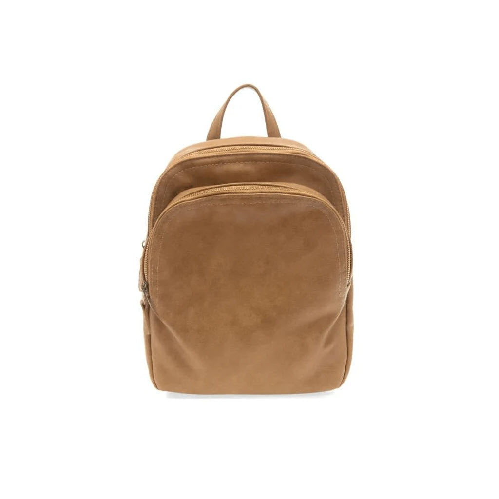 A brown JOY SUSAN FRANKIE soft backpack saddle with a handle and zippered compartments, isolated on a white background.